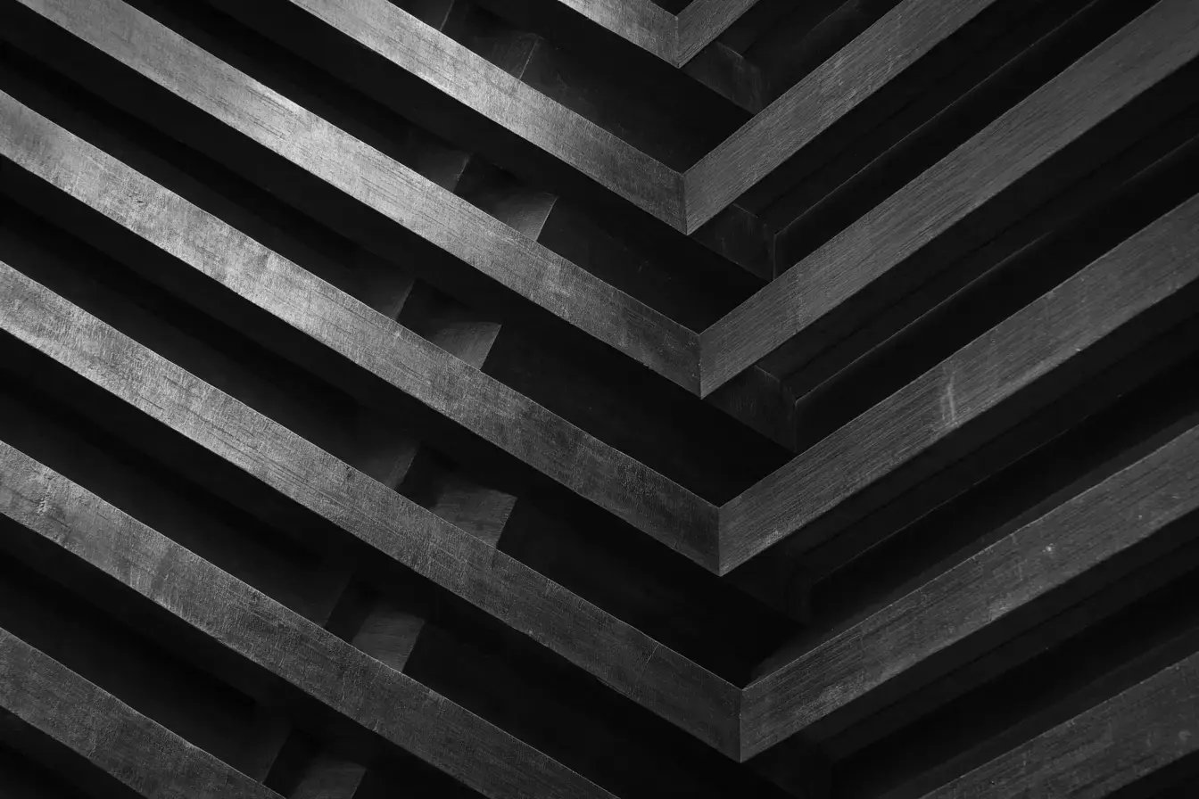 Sharp lines converging on center - industrial metal look - black and gray colors