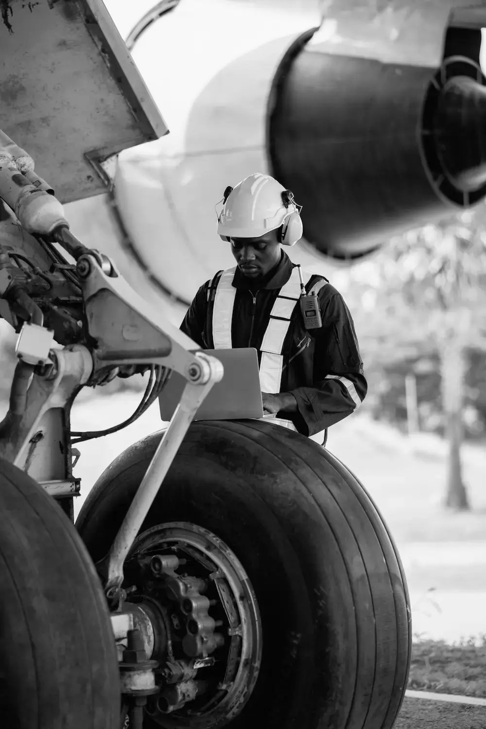 a worker inspecting aerospace landing gear